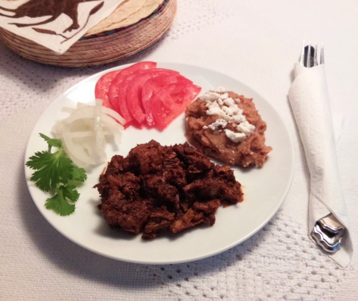 chilorio served with tortillas and refried beans